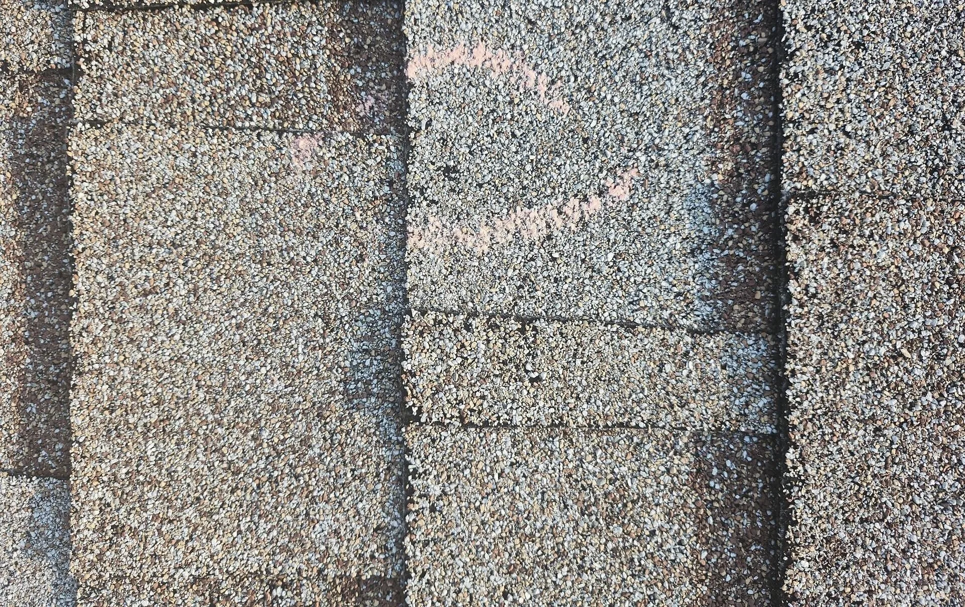 Asphalt shingles roof surface showing texture and granules, relevant to roofing lifespan and maintenance in South Florida.
